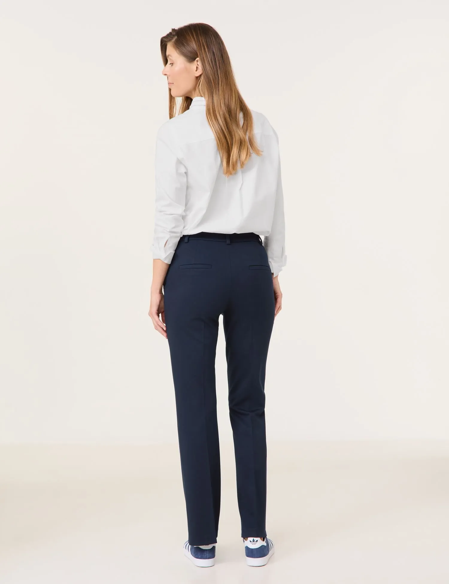 Flared cloth trousers with vertical pintucks