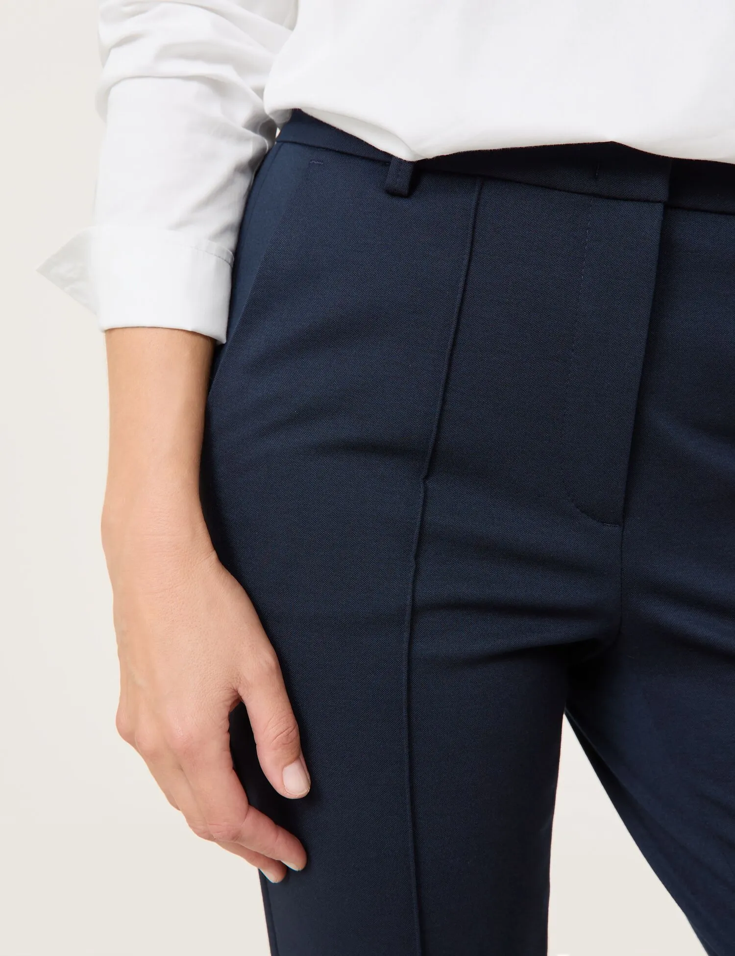 Flared cloth trousers with vertical pintucks