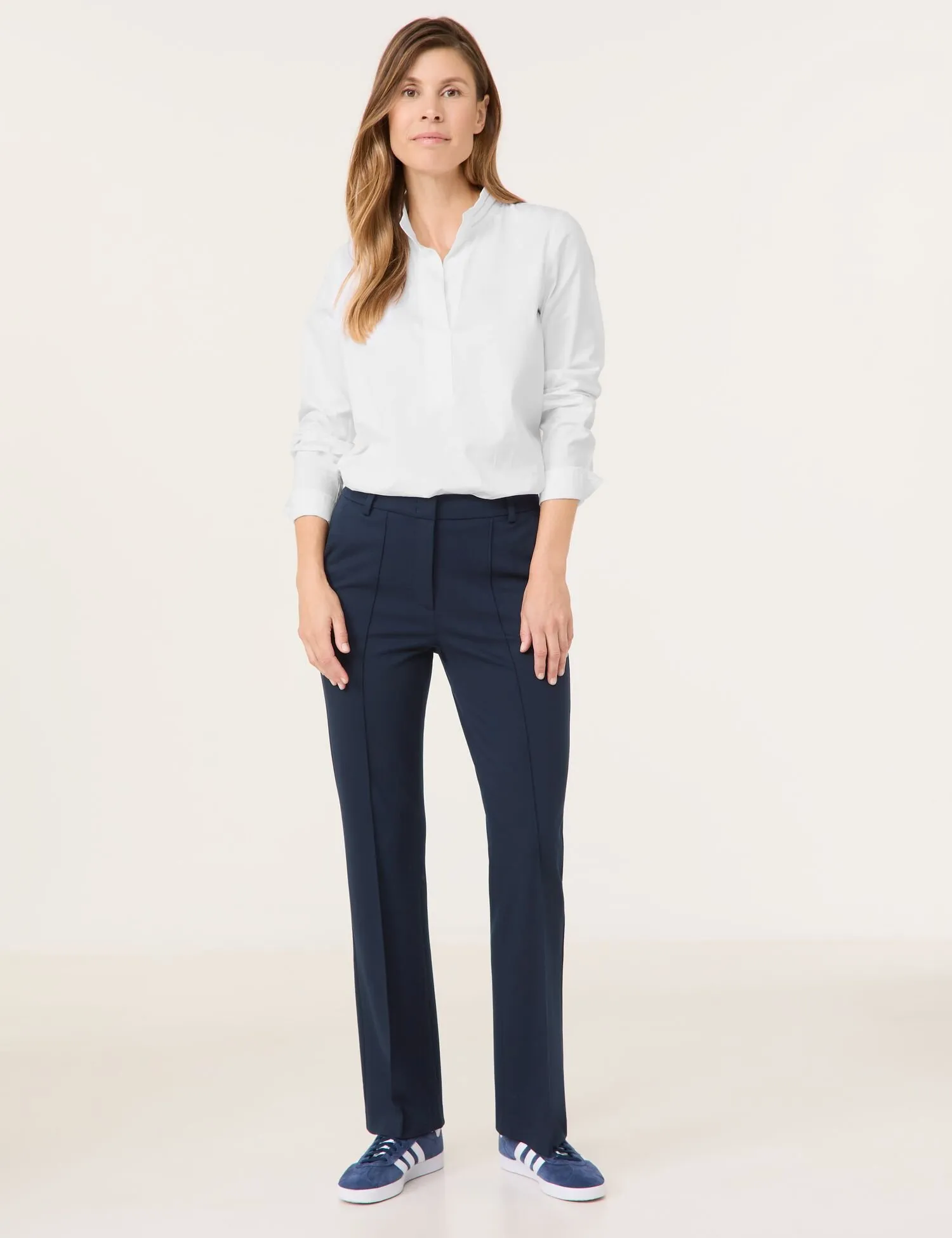 Flared cloth trousers with vertical pintucks